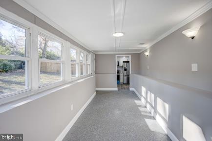 hallway with ornamental molding