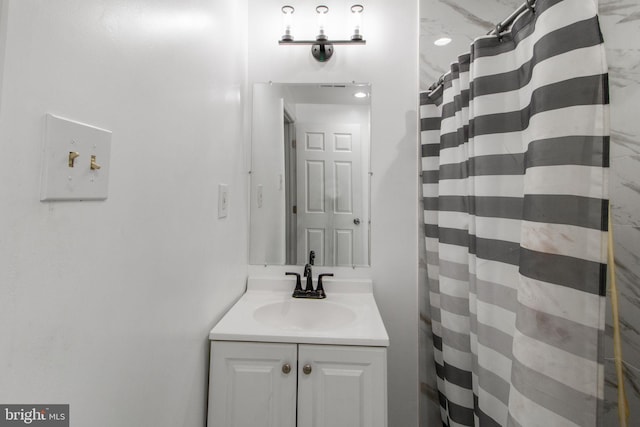 bathroom with a shower with curtain and vanity