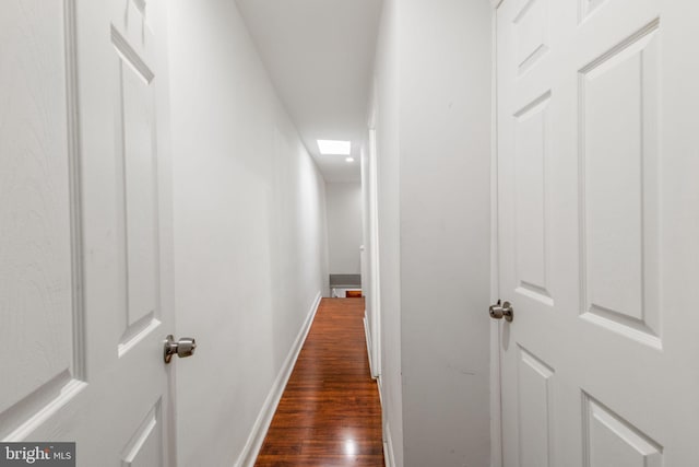 hallway featuring dark hardwood / wood-style flooring