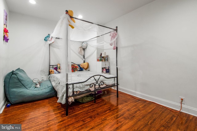 bedroom with wood-type flooring