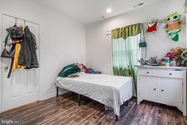 bedroom featuring dark hardwood / wood-style flooring