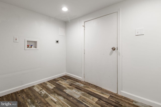 laundry room with electric dryer hookup, washer hookup, and dark hardwood / wood-style floors