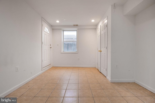 empty room with light tile patterned floors