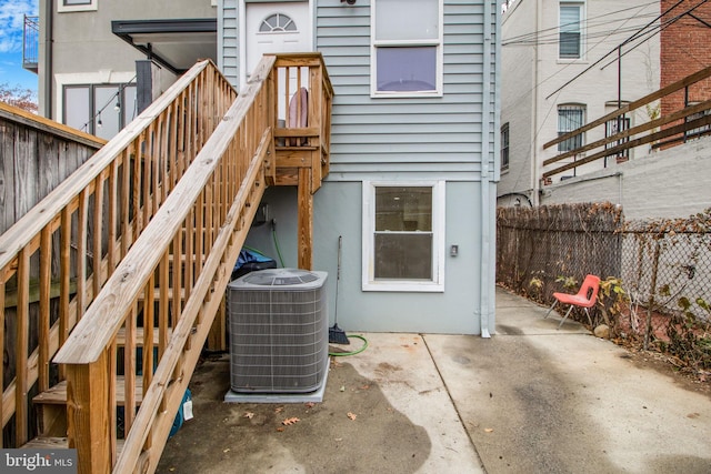 doorway to property with a patio area and central AC unit