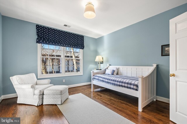 bedroom featuring dark hardwood / wood-style floors