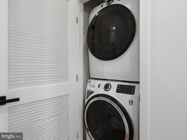 washroom with stacked washer and clothes dryer