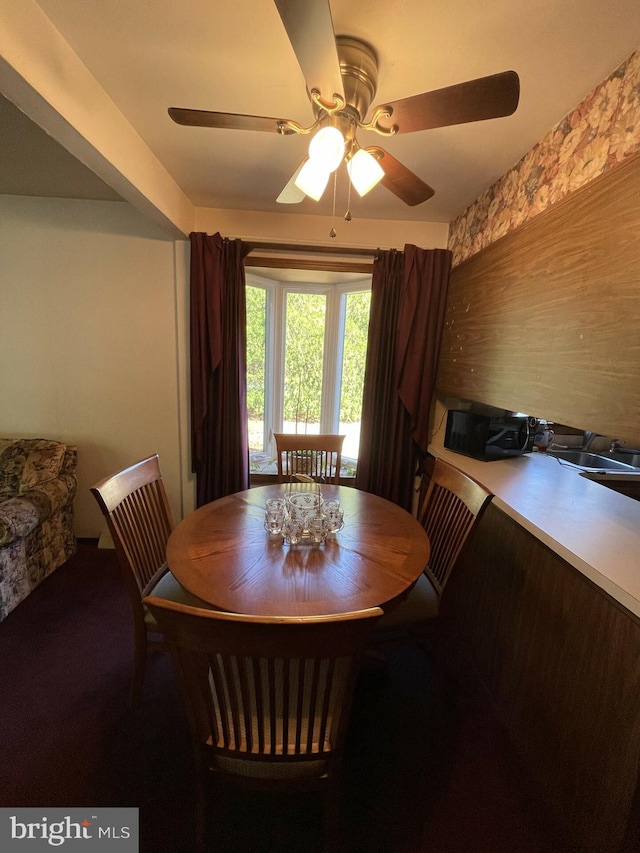 dining space featuring ceiling fan