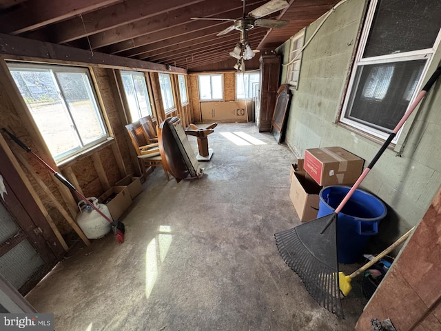 misc room featuring plenty of natural light, ceiling fan, concrete floors, and vaulted ceiling