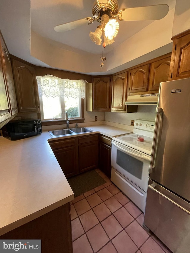 kitchen with ceiling fan with notable chandelier, white electric range, sink, light tile patterned floors, and stainless steel refrigerator