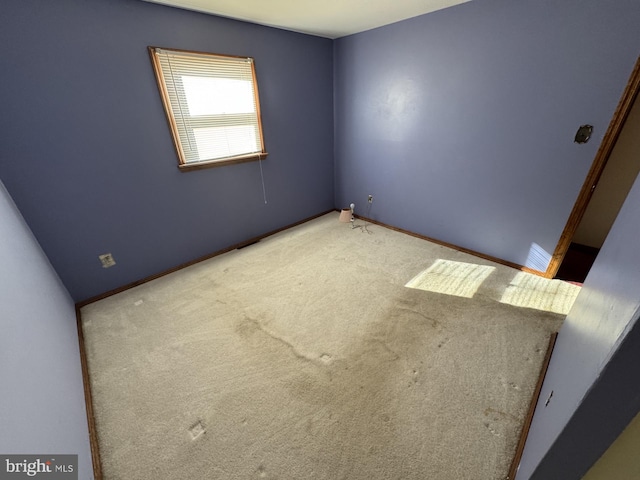 empty room featuring carpet flooring