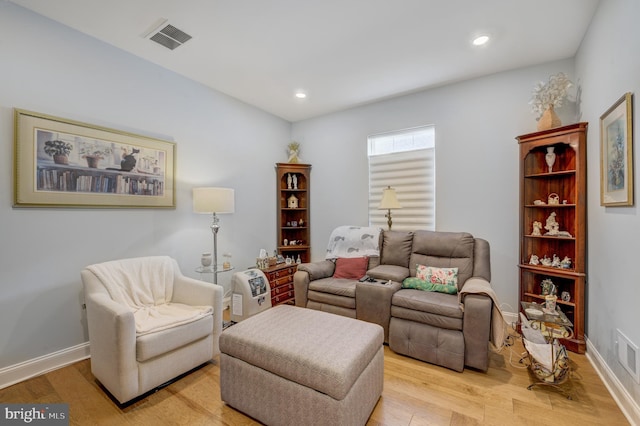 living room with light hardwood / wood-style floors