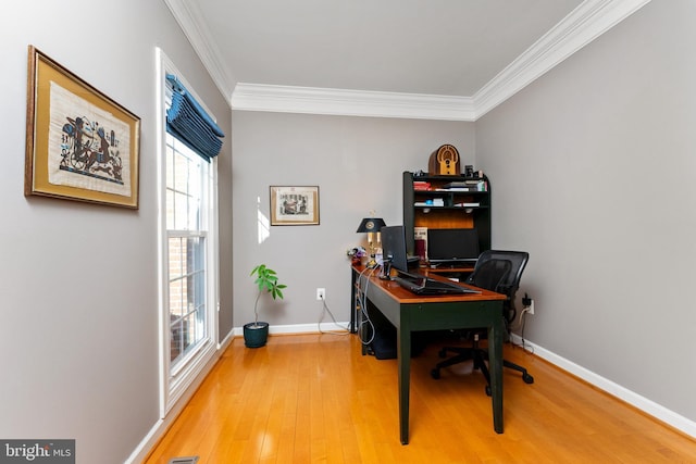 office with wood-type flooring and crown molding