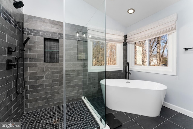 bathroom with tile patterned flooring, lofted ceiling, and shower with separate bathtub