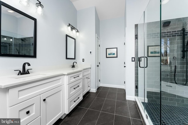 bathroom with tile patterned flooring, vanity, and an enclosed shower