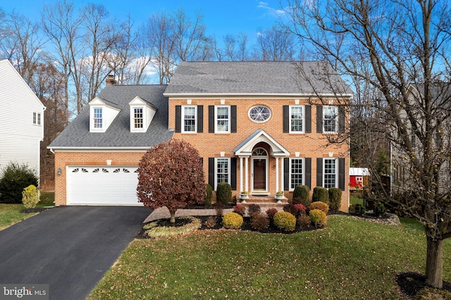 colonial home with a front yard