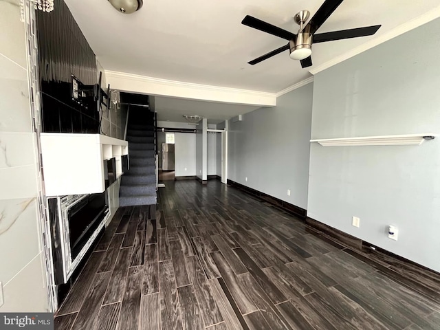 120 S Haven St, Baltimore, MD 21224 - unfurnished living room with ceiling fan, dark wood-style flooring, ornamental molding, baseboards, and stairs