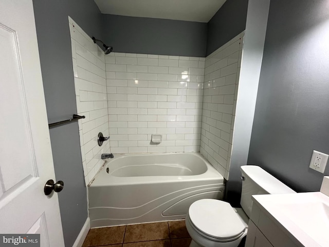 full bath featuring tile patterned floors, vanity, toilet, and bathing tub / shower combination