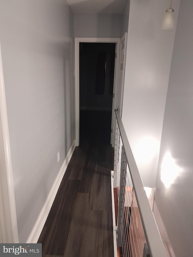 hallway featuring dark hardwood / wood-style flooring