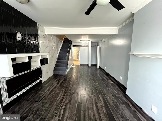 120 S Haven St, Baltimore, MD 21224 - unfurnished living room with stairs, wood finished floors, a ceiling fan, crown molding, and baseboards