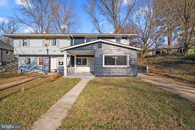 view of front of home featuring a front yard and a porch