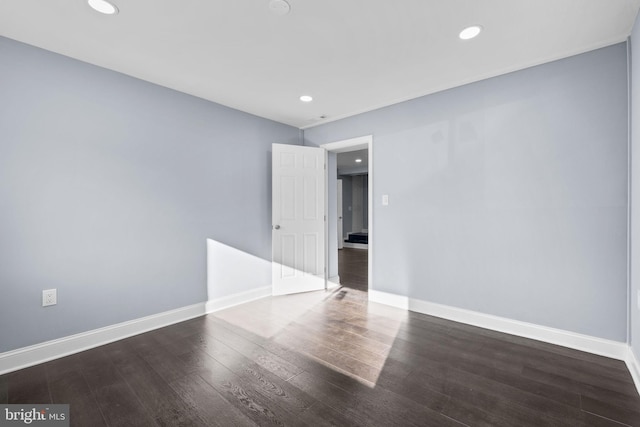 empty room featuring dark hardwood / wood-style floors