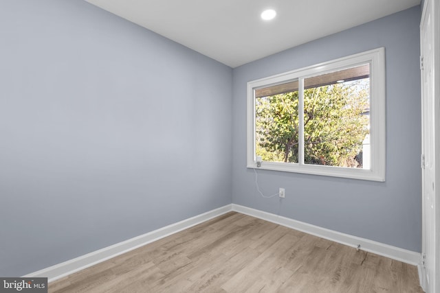 spare room featuring light wood-type flooring