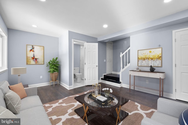 living room with dark hardwood / wood-style flooring