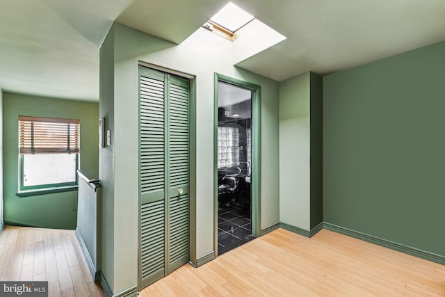 hallway featuring hardwood / wood-style floors