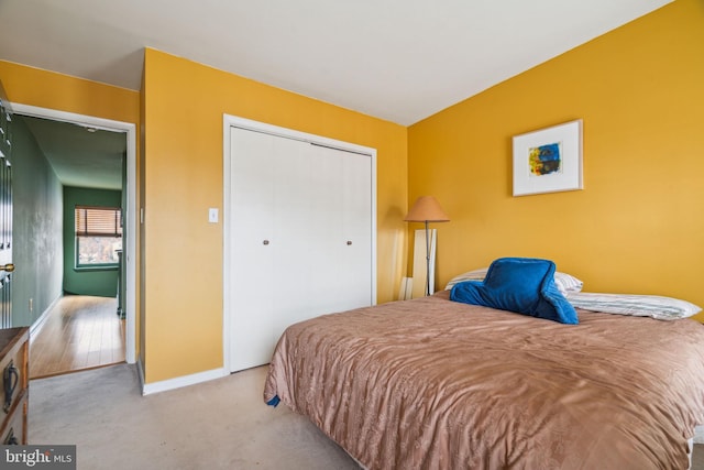 carpeted bedroom featuring a closet