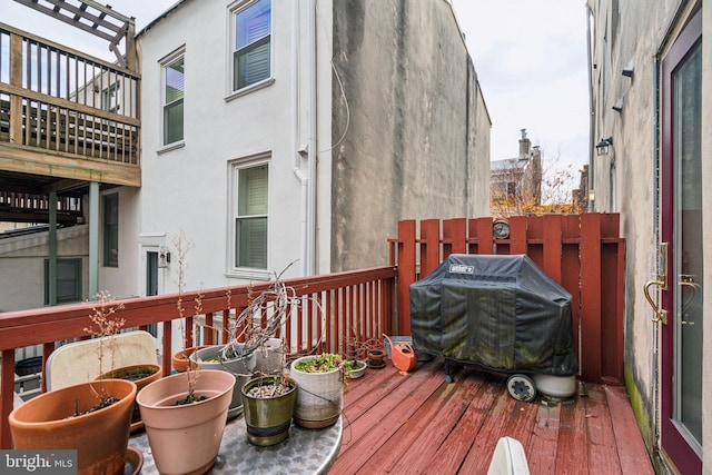 wooden deck with area for grilling