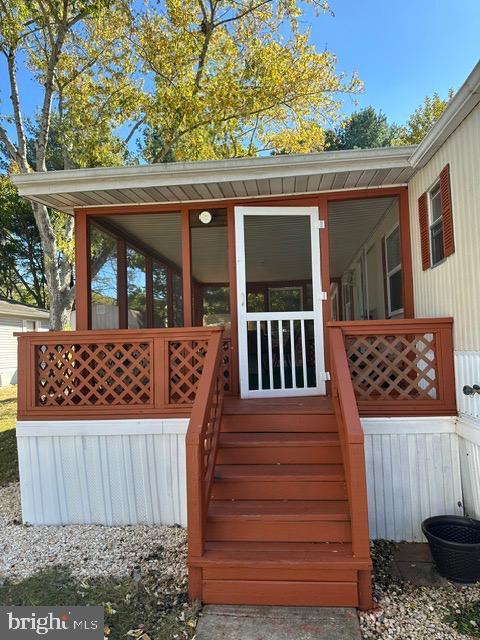 wooden terrace with a sunroom