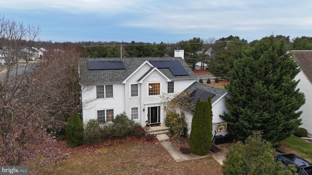 view of front of house with solar panels