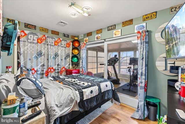 bedroom with hardwood / wood-style flooring