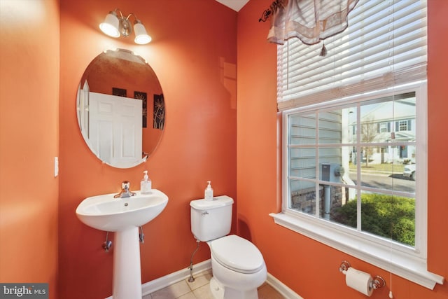 bathroom featuring tile patterned flooring and toilet