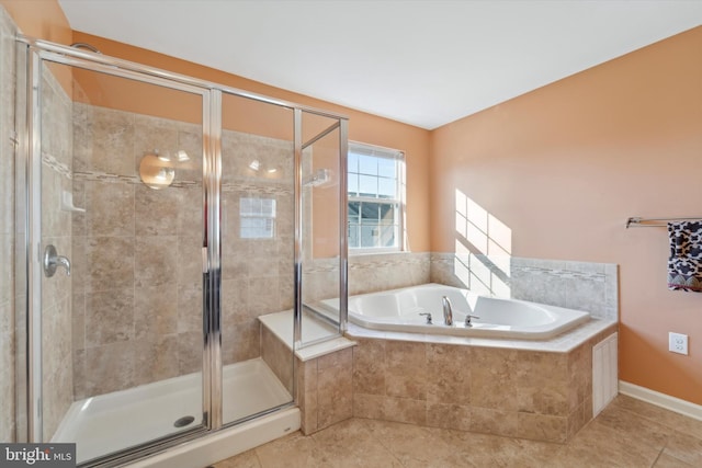 bathroom featuring tile patterned floors and independent shower and bath