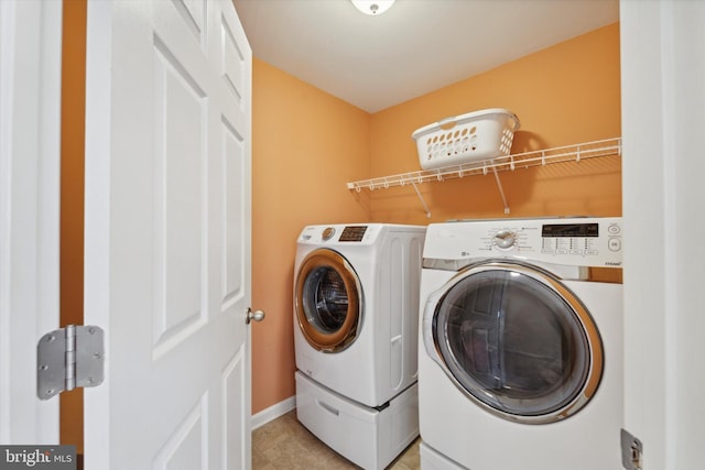 washroom featuring washer and dryer