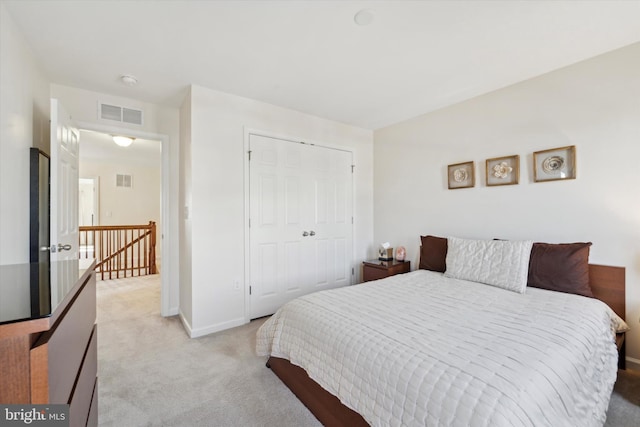 carpeted bedroom featuring a closet