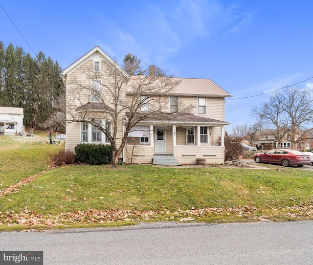 front of property featuring a front lawn