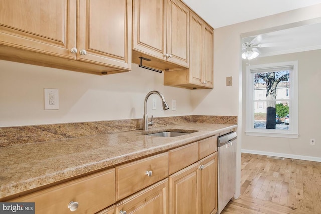 kitchen with light brown cabinets, sink, stainless steel dishwasher, ceiling fan, and light wood-type flooring