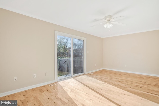 spare room with light hardwood / wood-style floors, ceiling fan, and ornamental molding