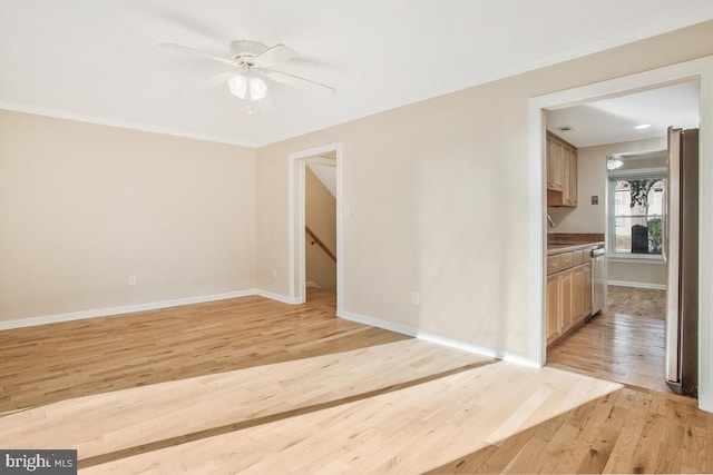 unfurnished room with light hardwood / wood-style floors, ceiling fan, and ornamental molding