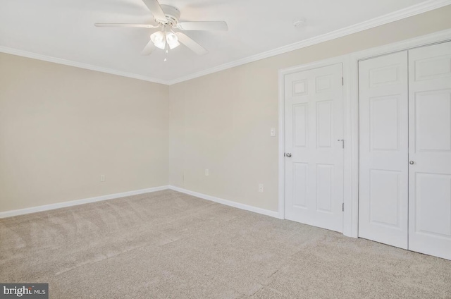 unfurnished bedroom featuring light colored carpet, ceiling fan, and ornamental molding