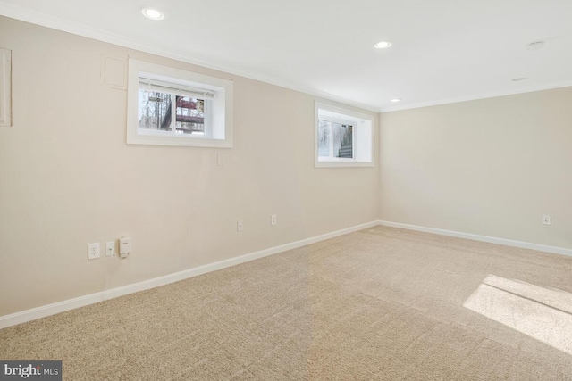 basement with carpet flooring and ornamental molding