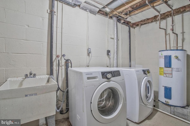 laundry area featuring water heater, sink, and independent washer and dryer