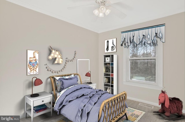 carpeted bedroom with ceiling fan and ornamental molding