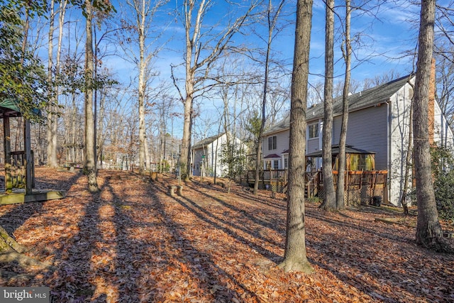 view of yard featuring a wooden deck