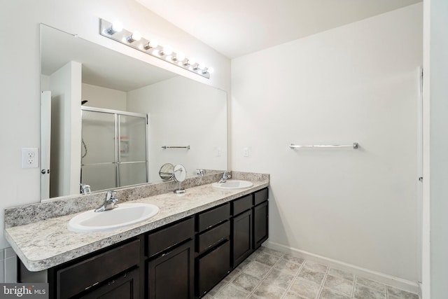 bathroom with vanity and an enclosed shower