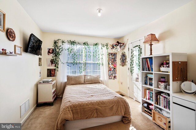 bedroom with light carpet