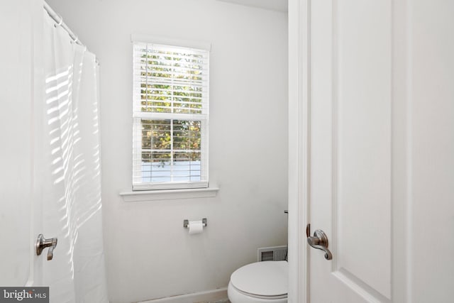 bathroom featuring toilet