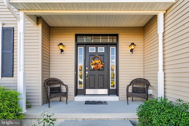 entrance to property featuring covered porch